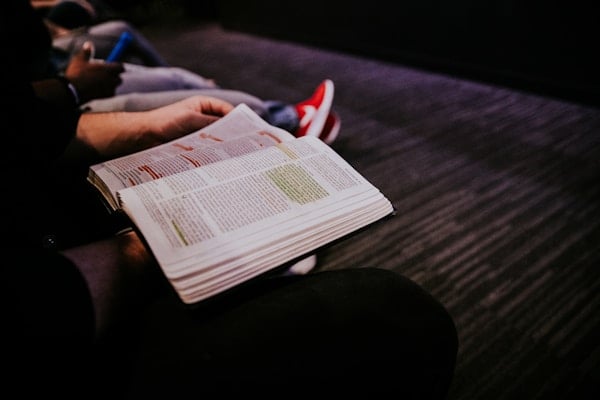 Students reading the Bible during chapel at Sunshine Bible Academy